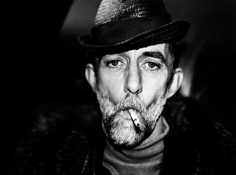 man with cigarette and hat
