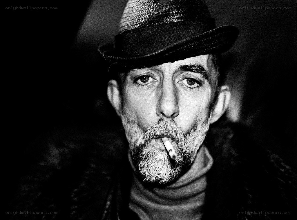 man with cigarette and hat
