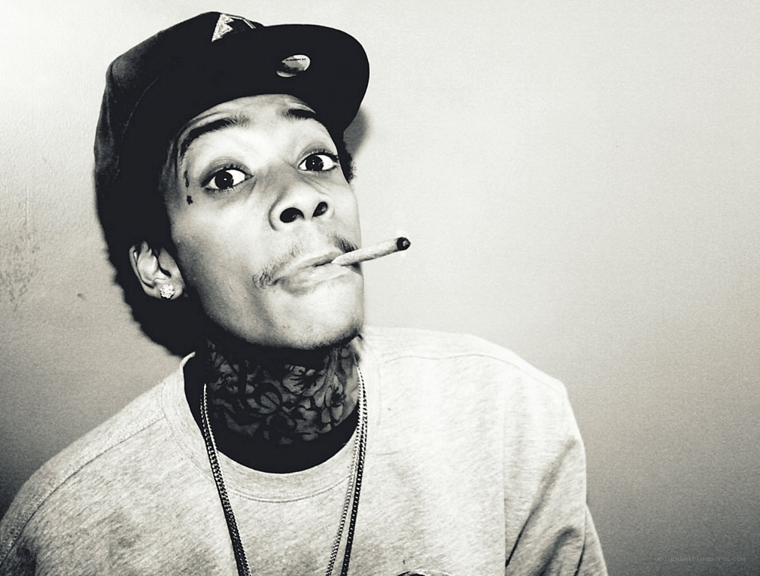 man with cigarette and tattoos
