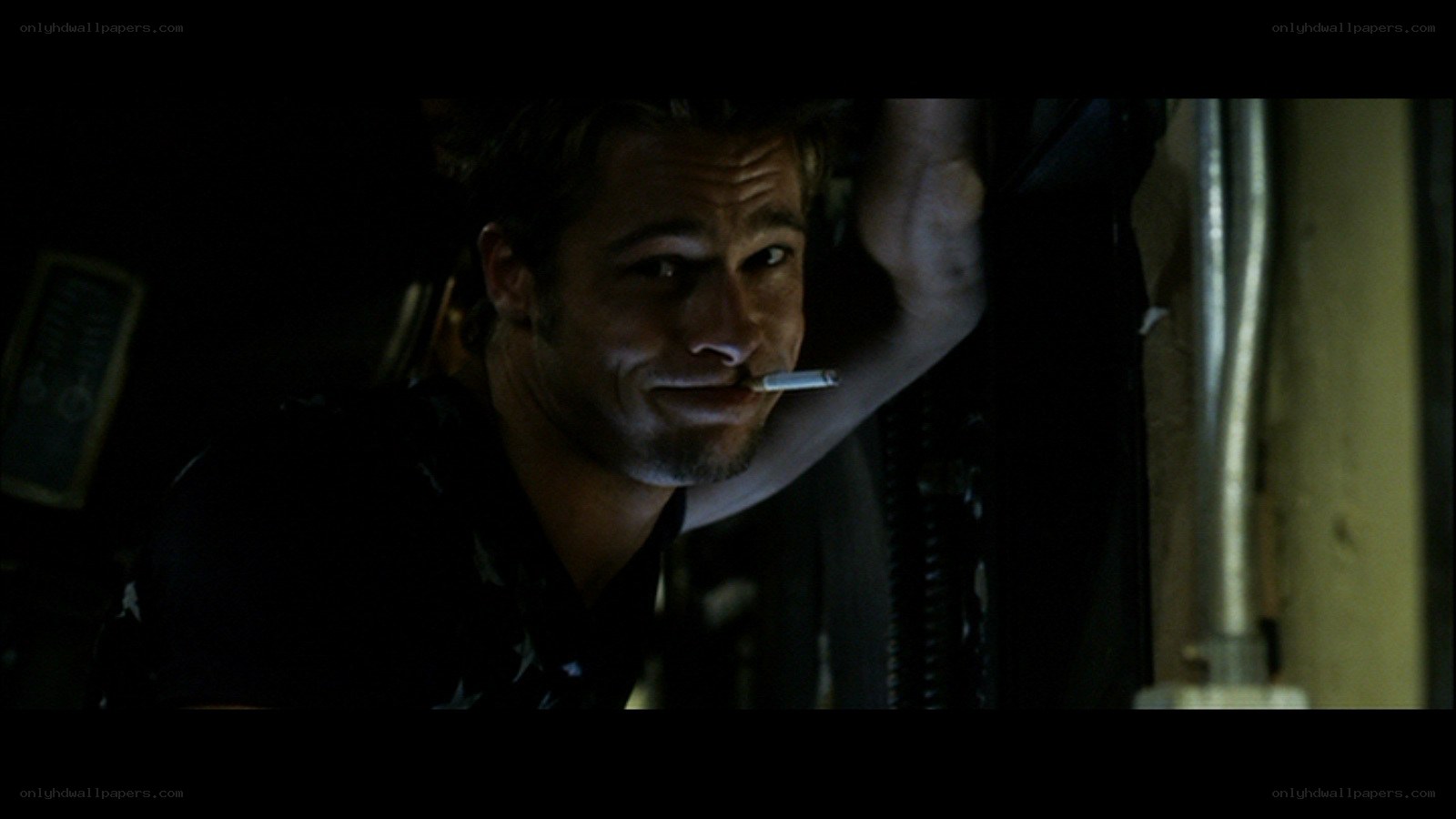 man with cigarette in dark room