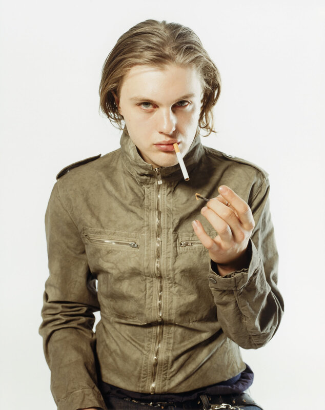 man with cigarette in jacket