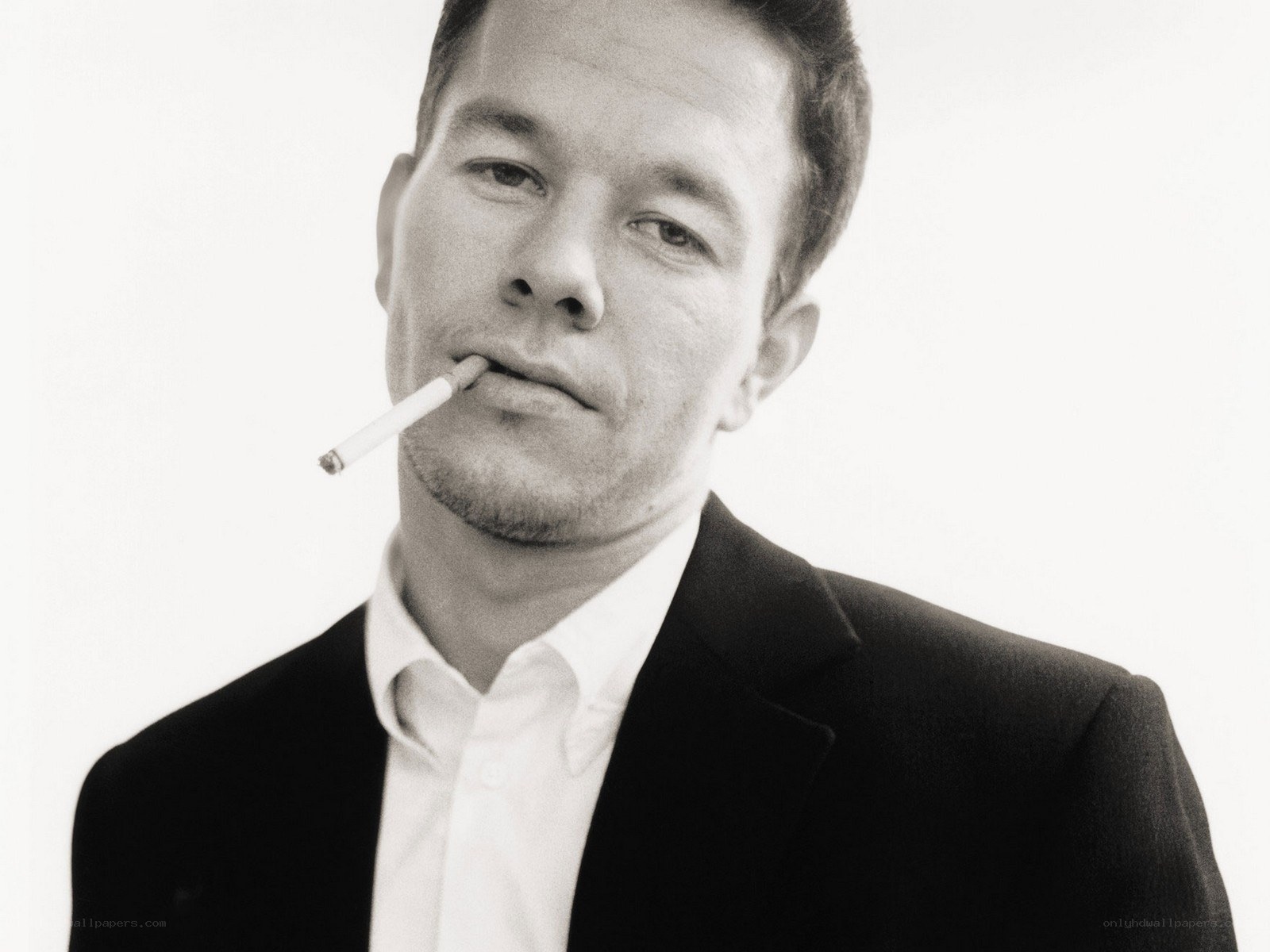 man with cigarette in suit
