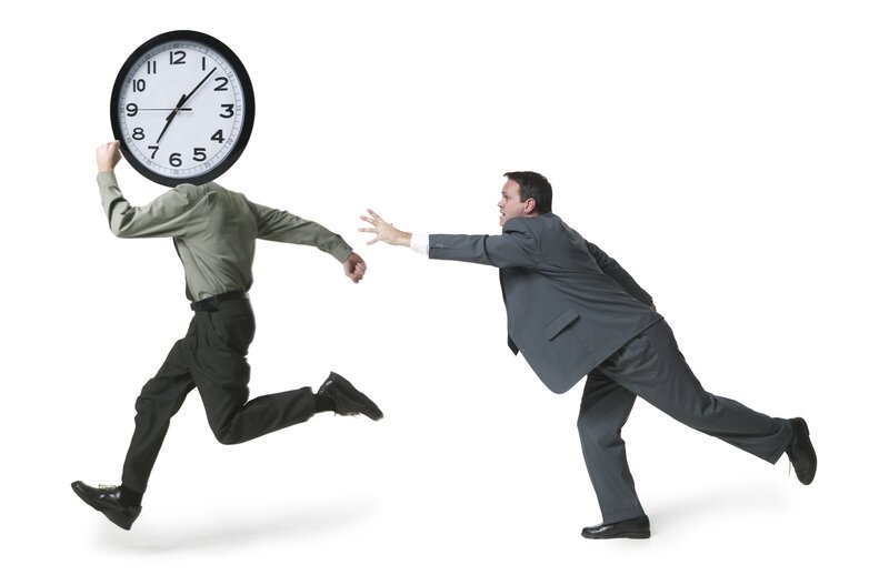 Man with clock head running