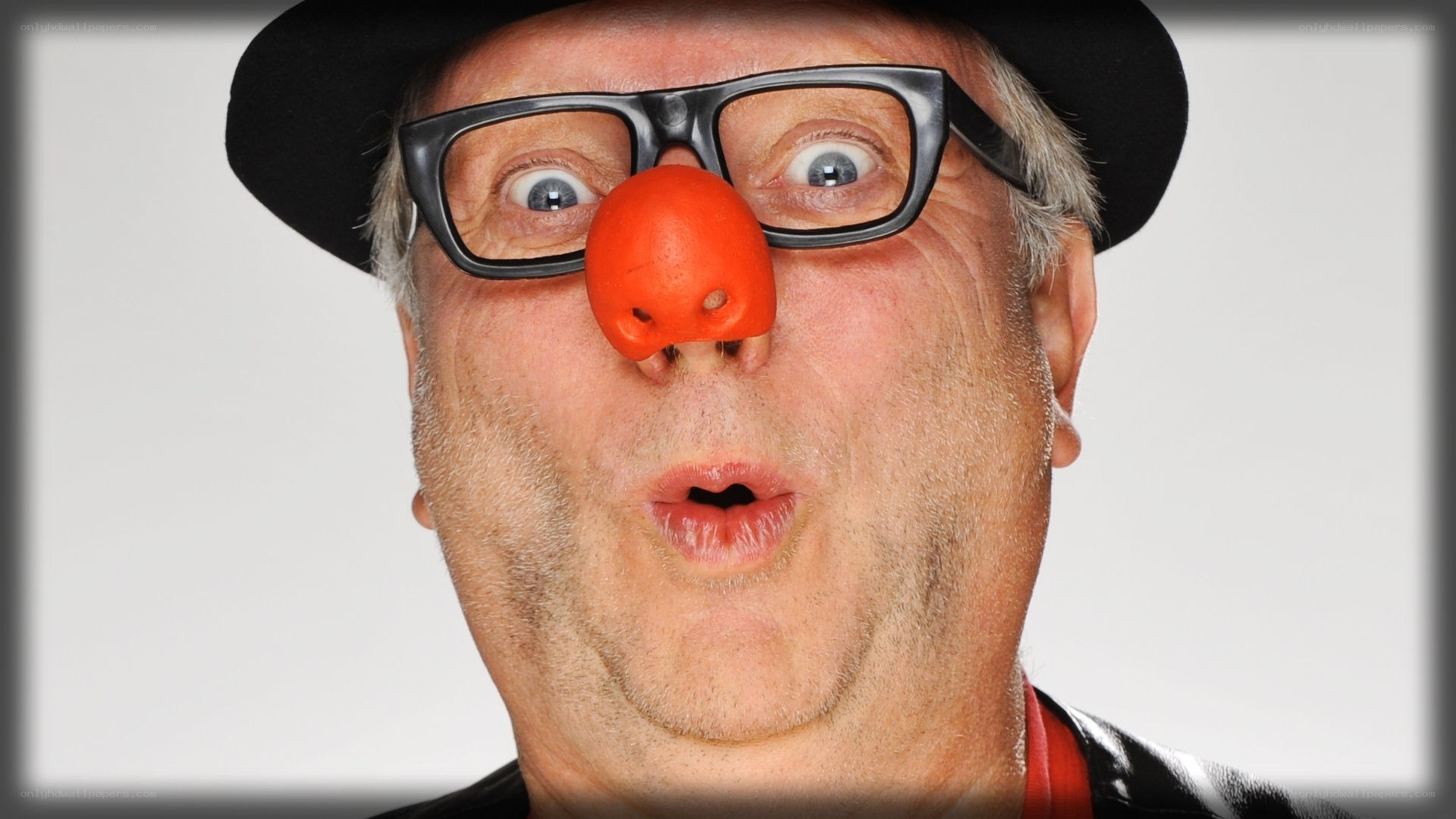 man with clown nose and glasses