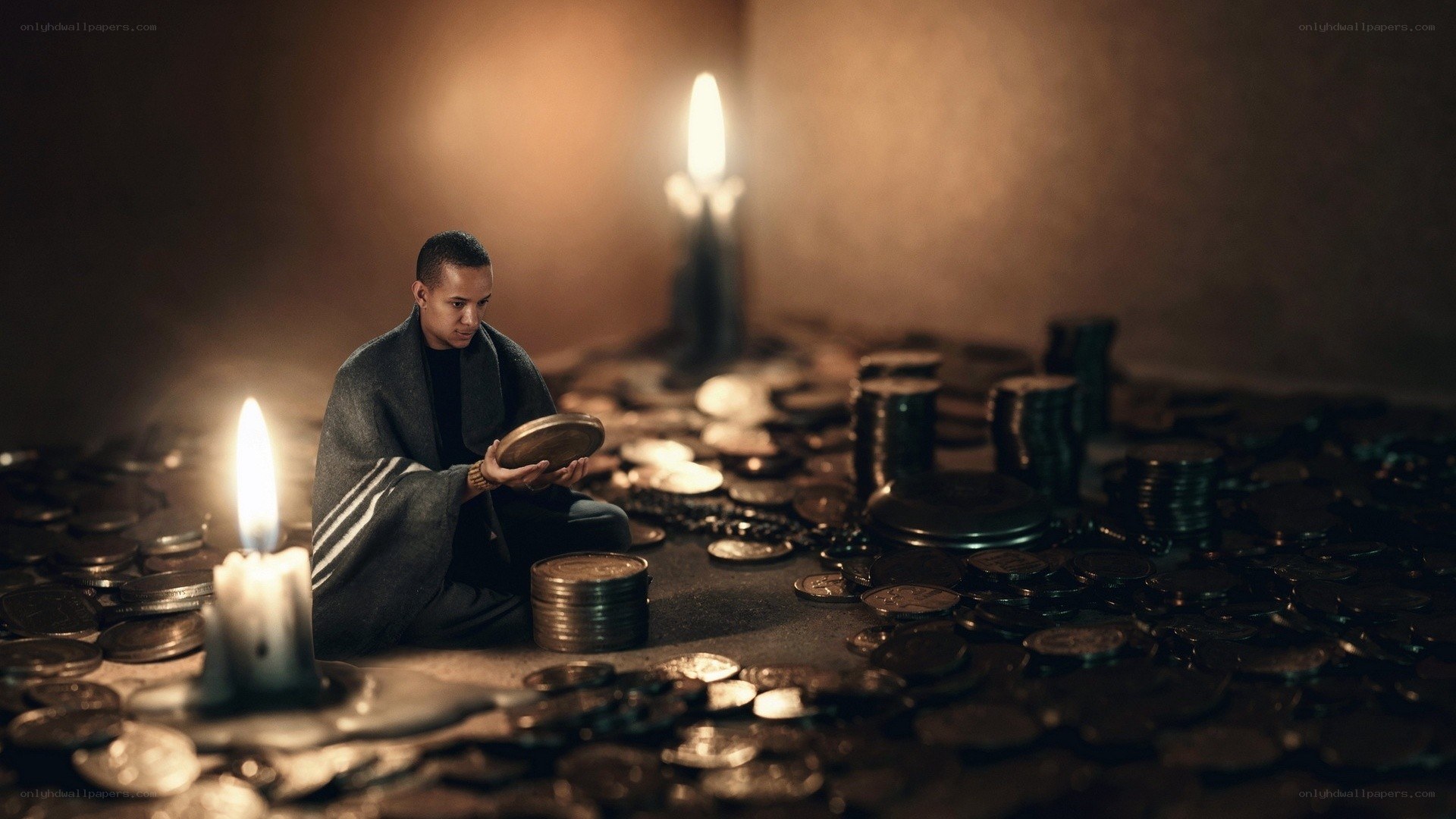 Man with coins in candlelight