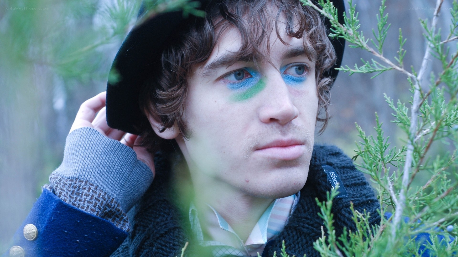 man with colorful face paint