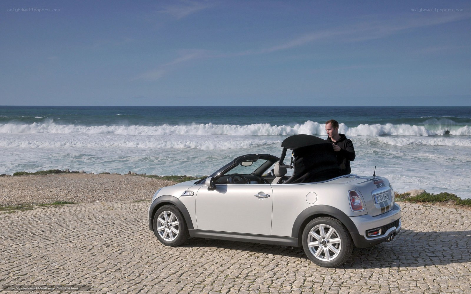 Man with convertible on beach