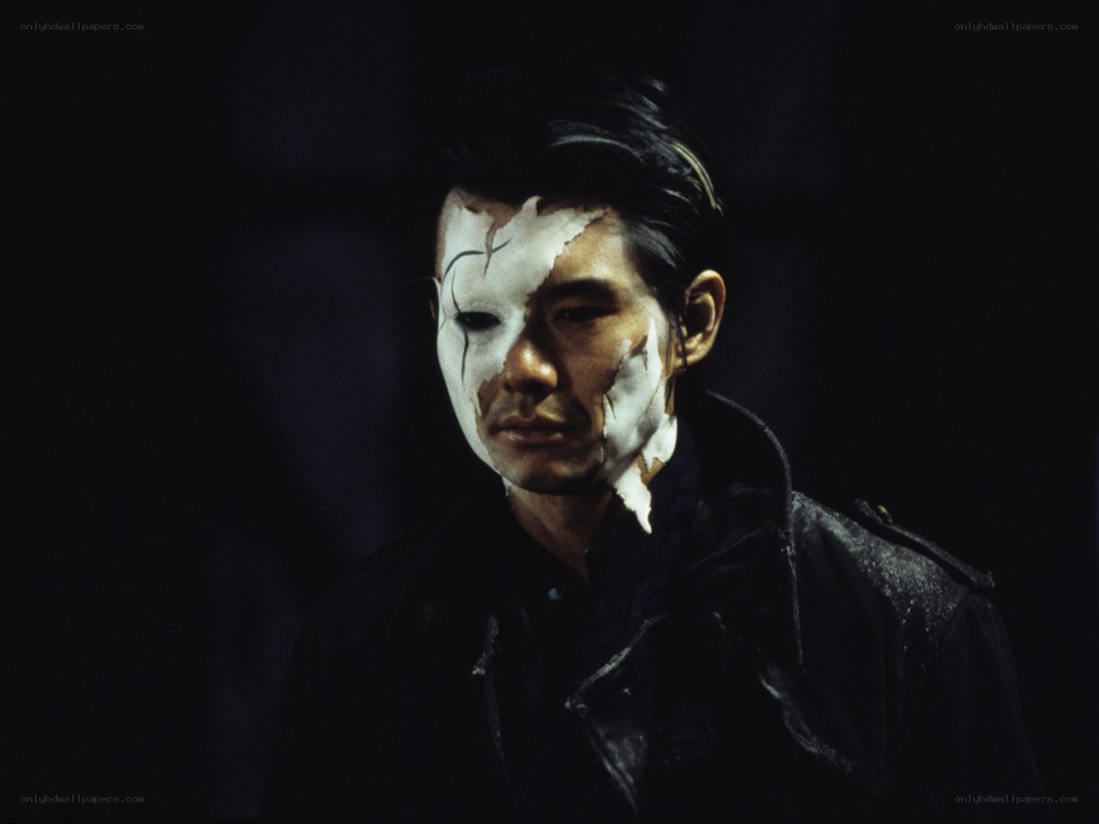 man with cracked white face paint