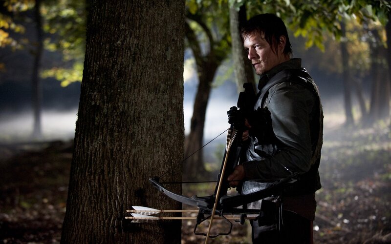 man with crossbow in forest