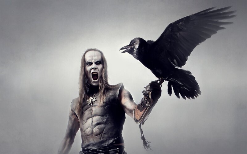 man with crow on arm