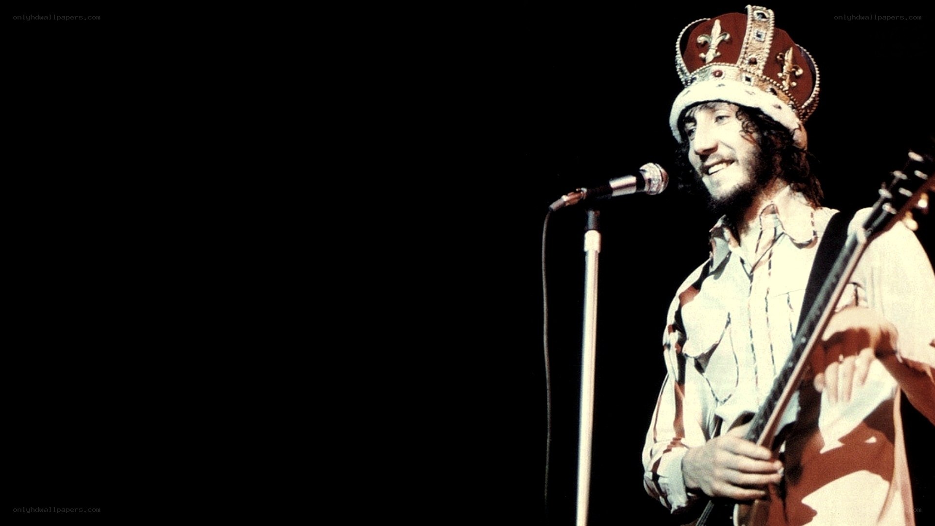 man with crown on stage