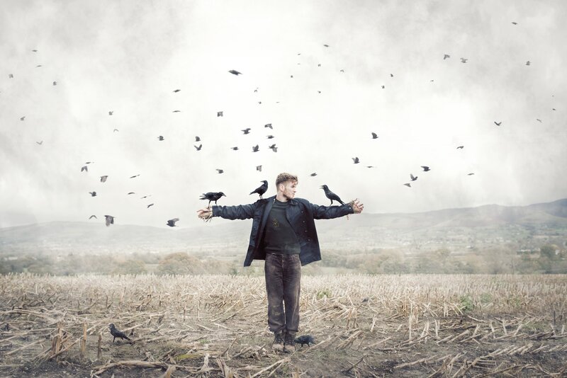 Man with Crows in Field
