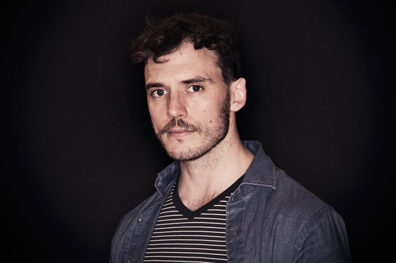 man with curly hair and beard
