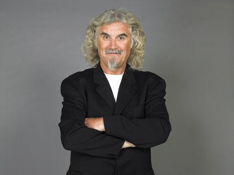 man with curly hair and black jacket