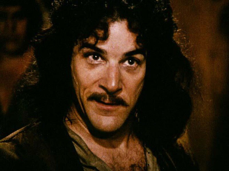 man with curly hair and mustache