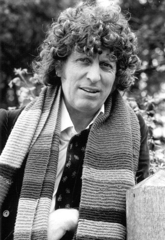man with curly hair and scarf