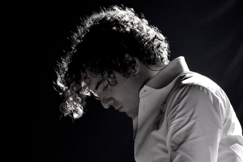 Man with Curly Hair — Black, Dramatic, Photograph, Curly Hair, Shirt