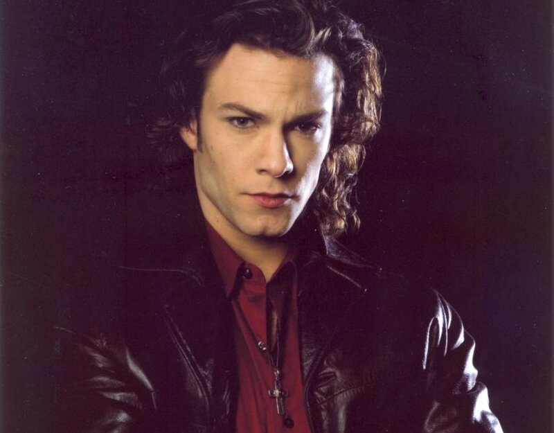 Man with Curly Hair — Black, Dramatic, Photograph, Leather Jacket