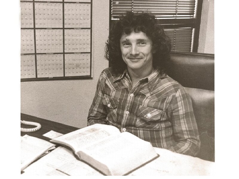 Man with Curly Hair — Black, Neutral, Photograph, Desk