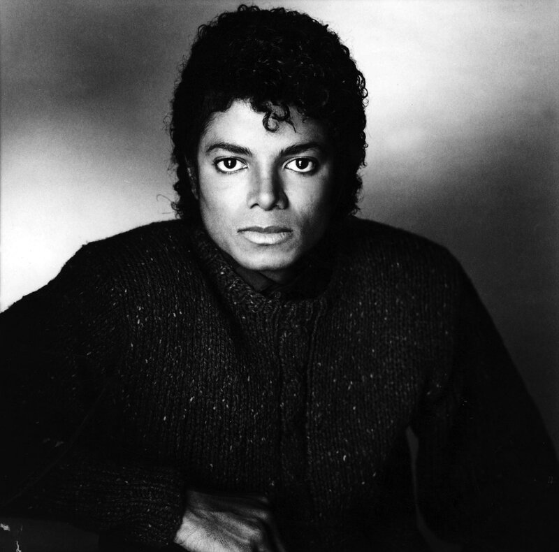 Man with Curly Hair — Black, Serious, Photograph, Sweater