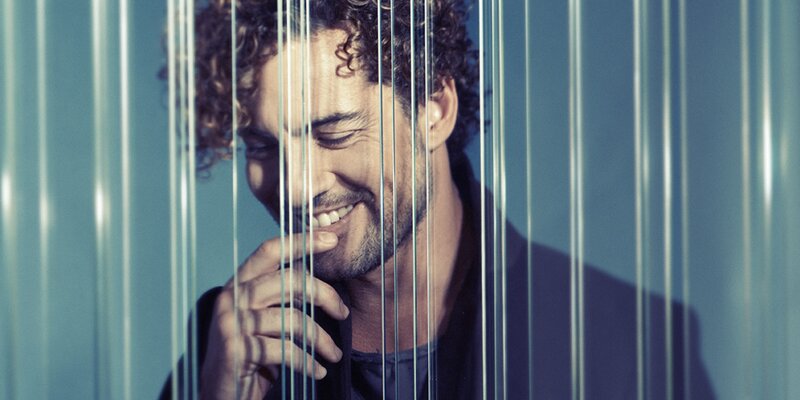 Man with Curly Hair — Blue, Contemplative, Photograph, Curly Hair, Hand
