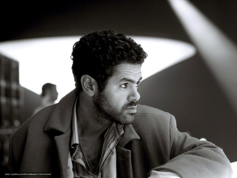 man with curly hair in black and white