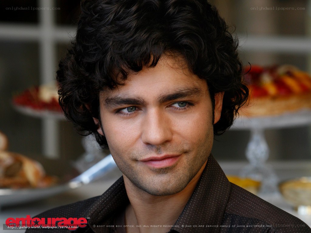 man with curly hair in cafe