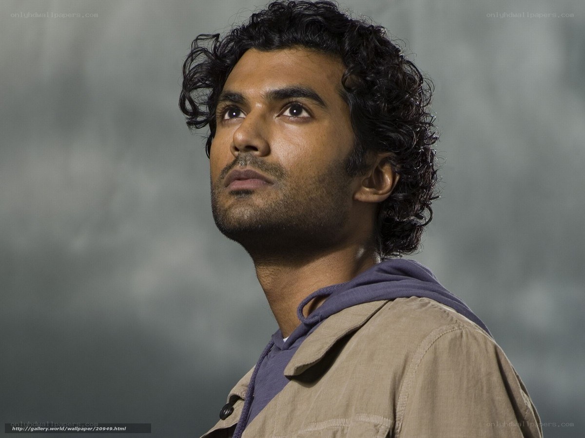 man with curly hair looking up