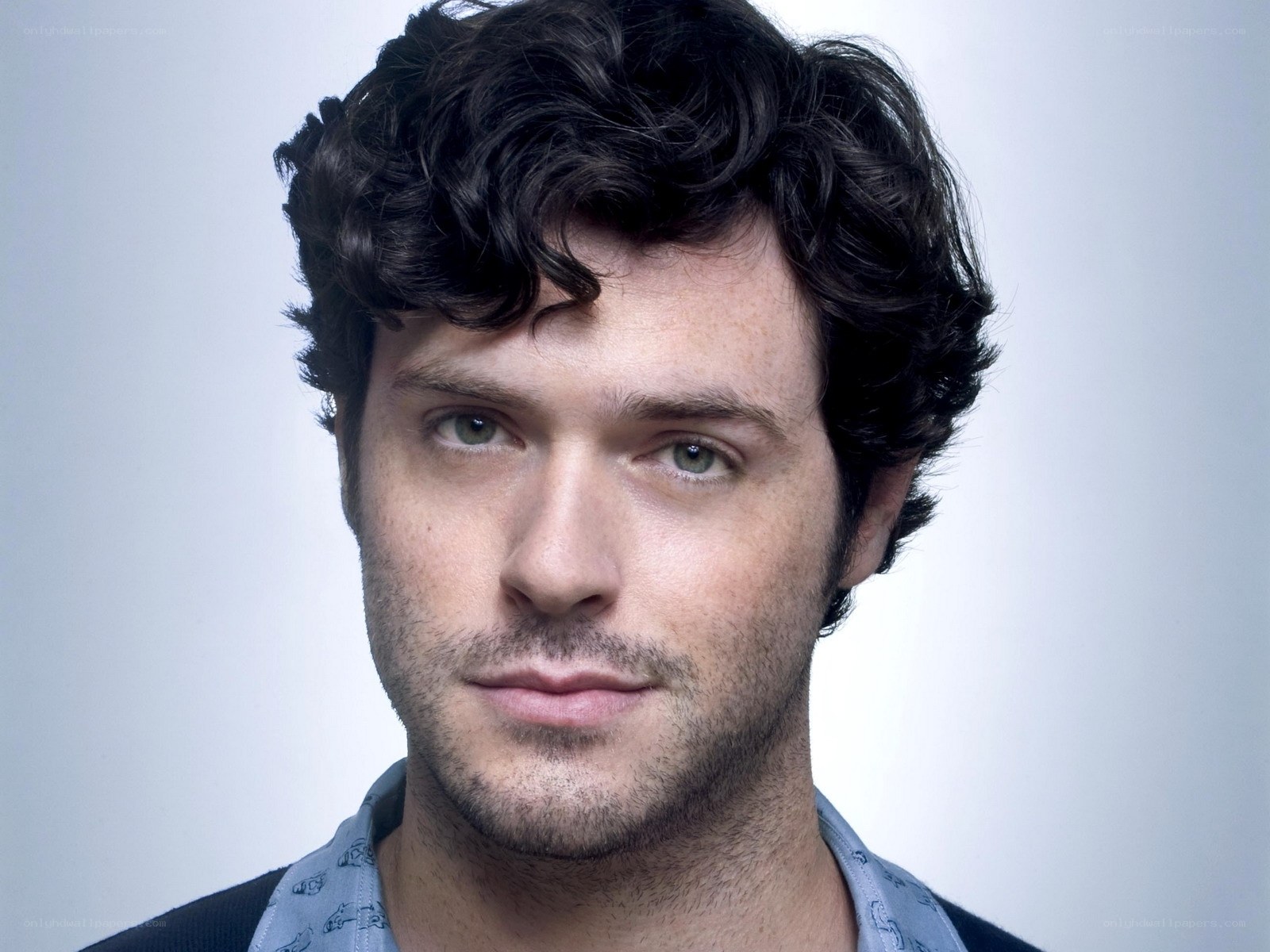 man with curly hair portrait