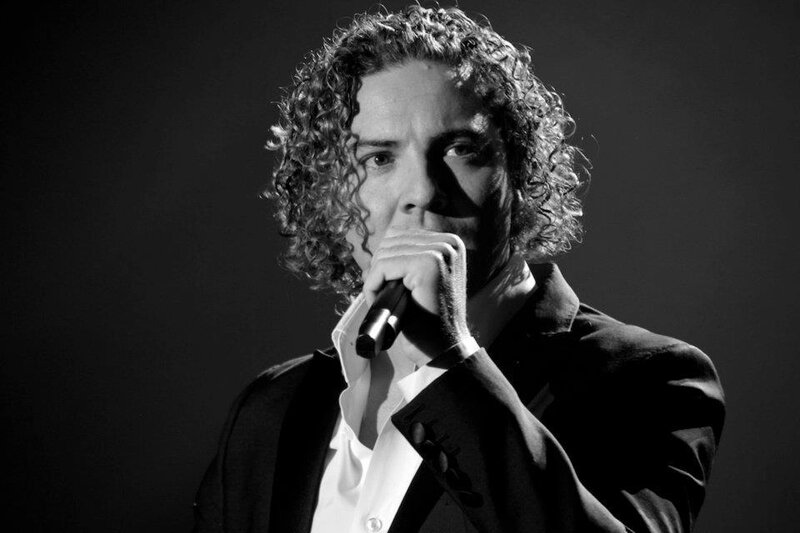 Man with Curly Hair Singing — Black
