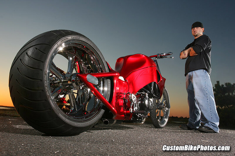 Man with custom red motorcycle
