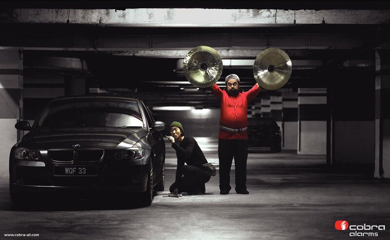 Man with cymbals in parking garage
