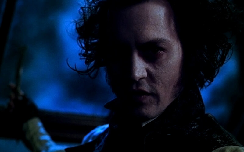 man with dark curly hair