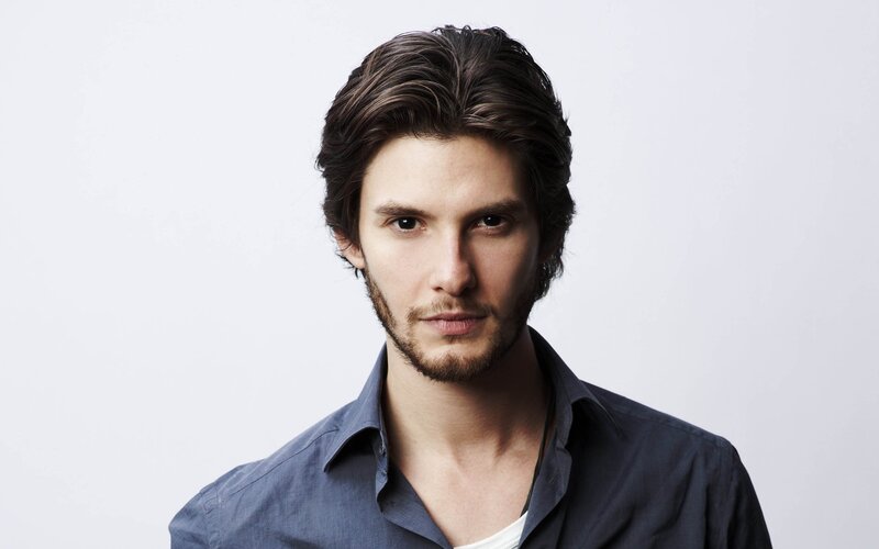 man with dark hair and beard