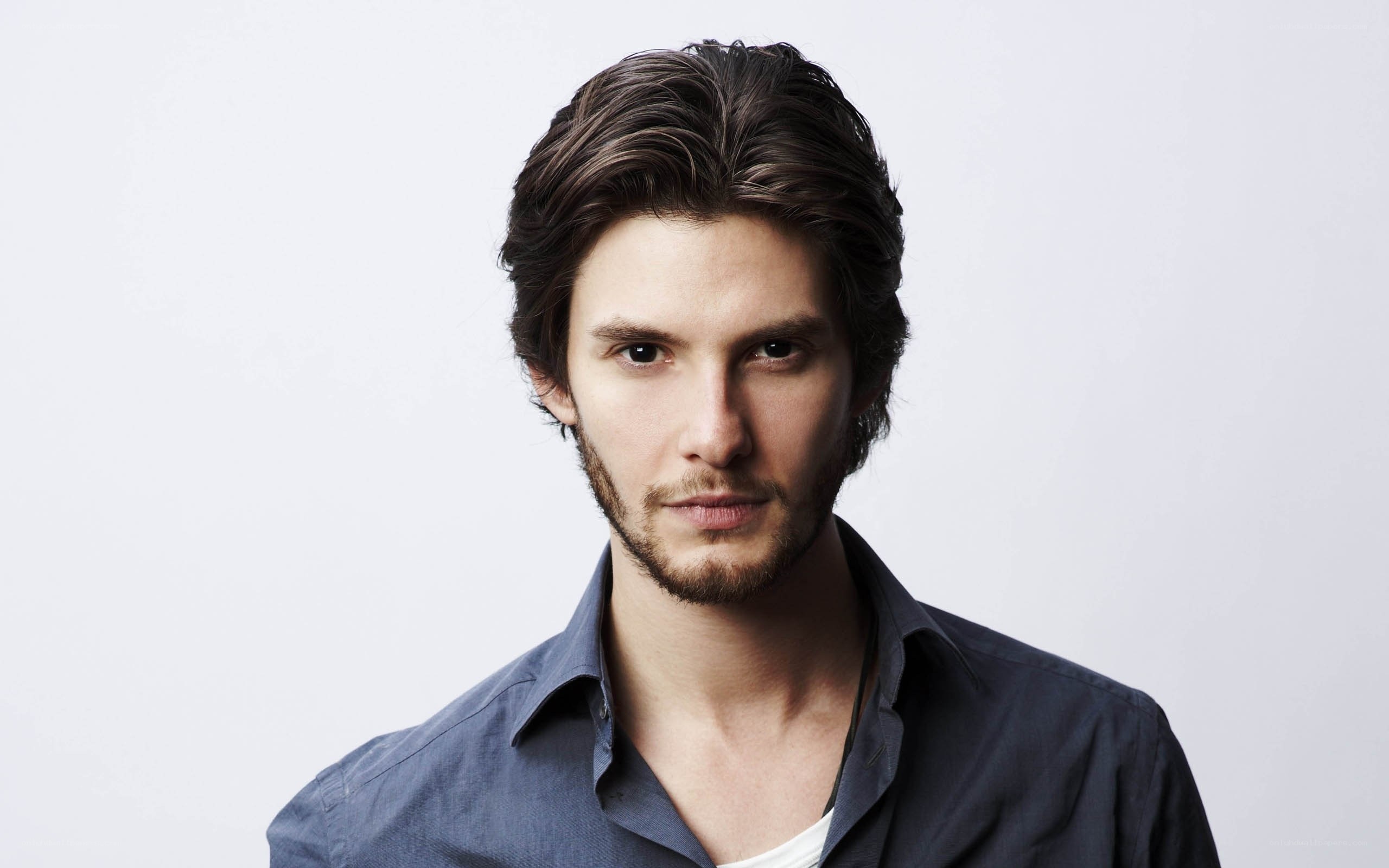 man with dark hair and beard