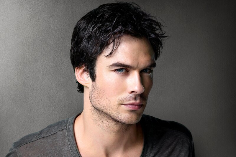 man with dark hair and blue eyes