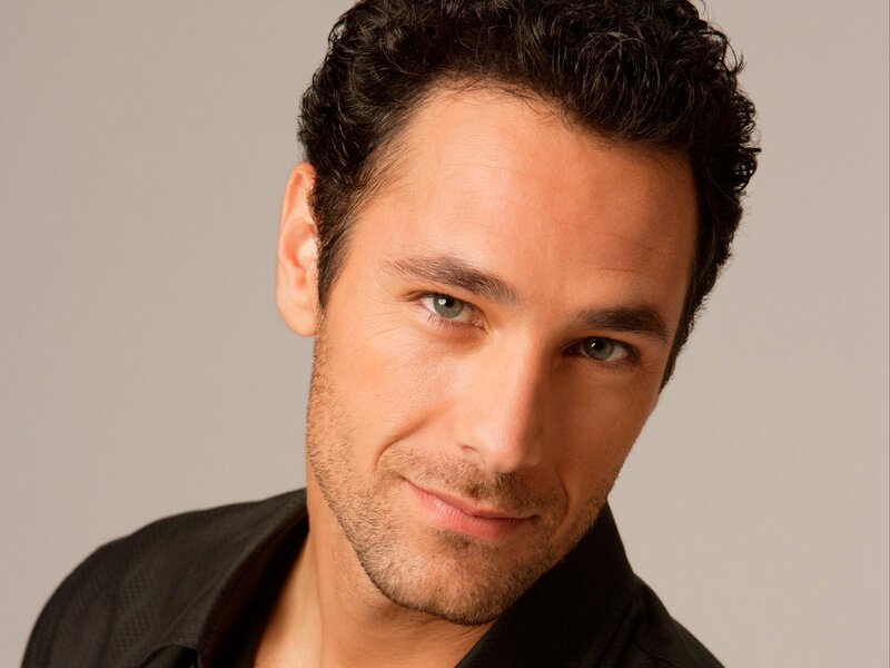 man with dark hair and green eyes