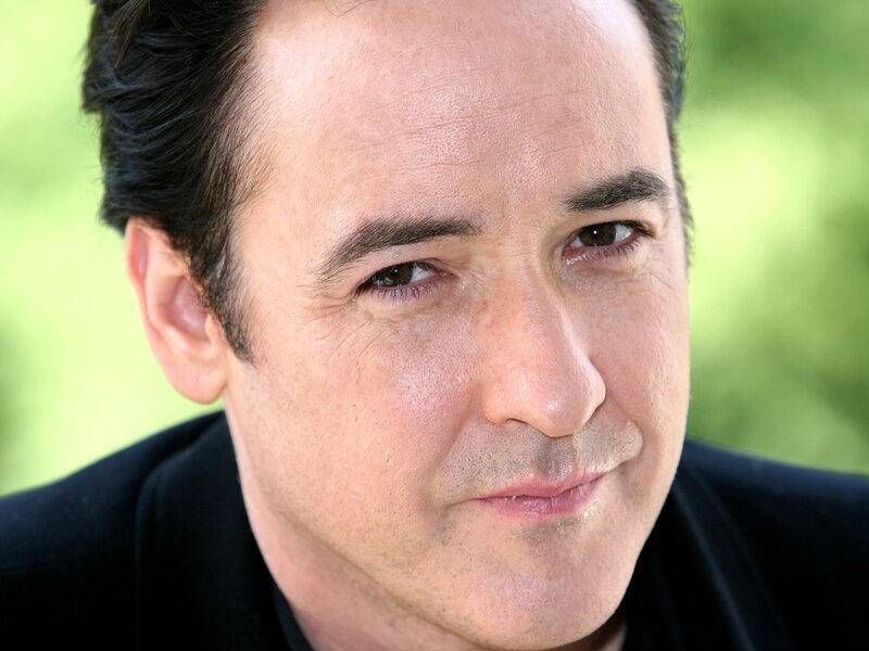 Man with Dark Hair — Black, Neutral, Photograph, Black Jacket, Green Background