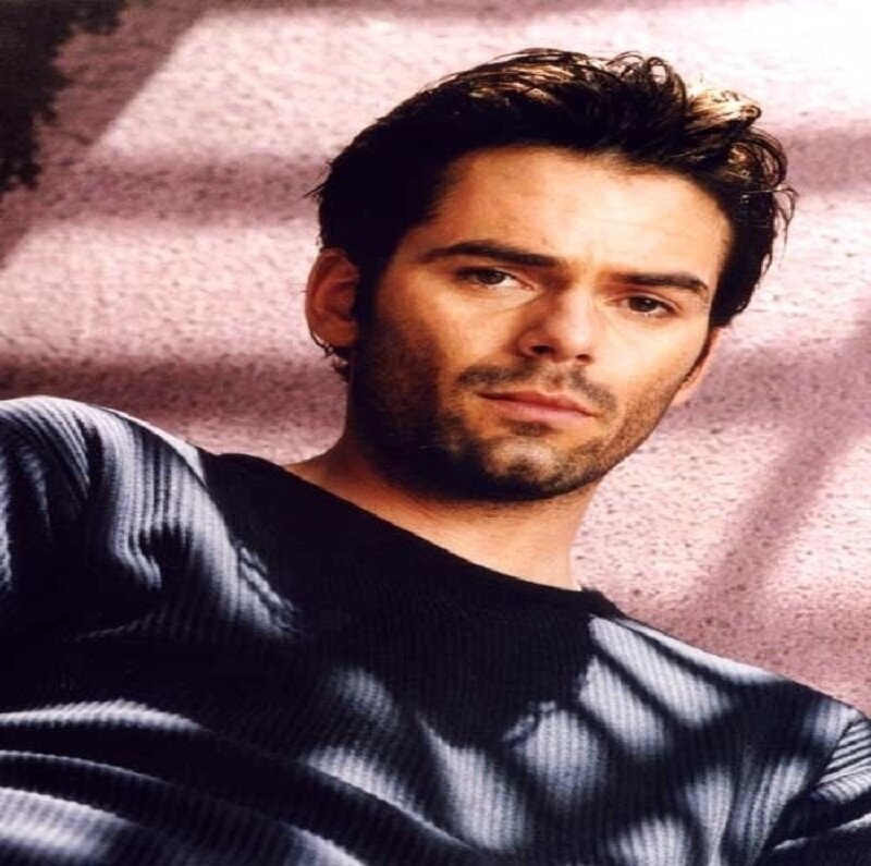 Man with Dark Hair — Black, Serious, Photograph, Black Sweater