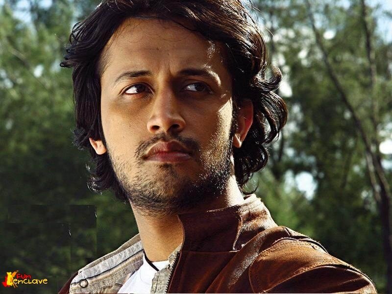 man with dark hair outdoors