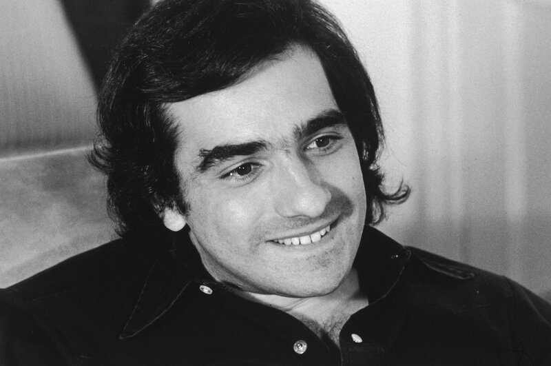 man with dark hair smiling