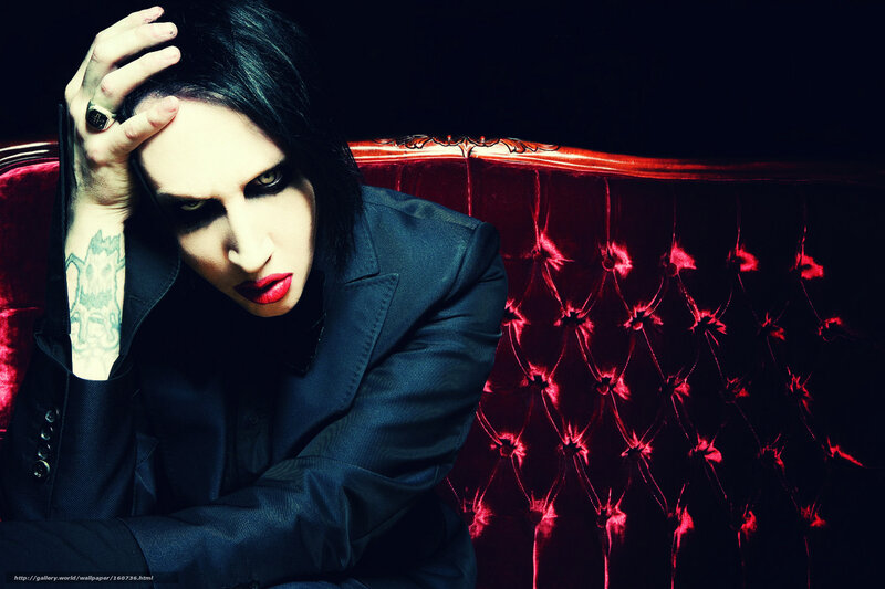 Man with dark makeup on couch