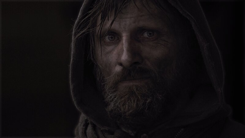 man with dirty face in hood