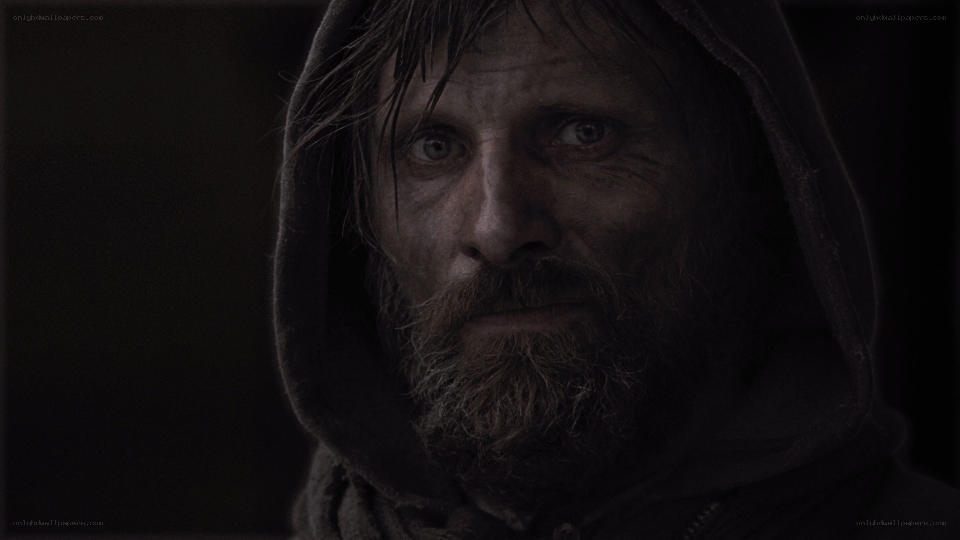 man with dirty face in hood
