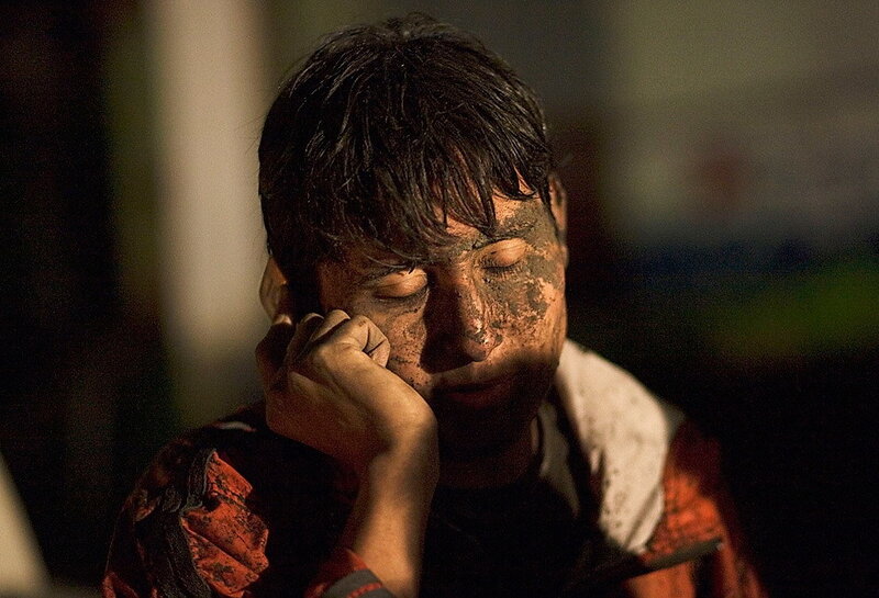 man with dirty face resting