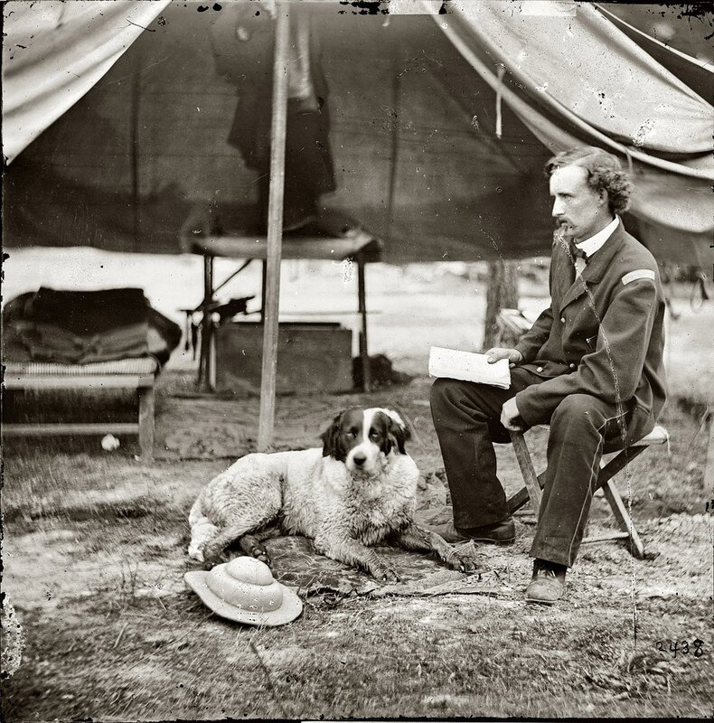 Man with dog in camp