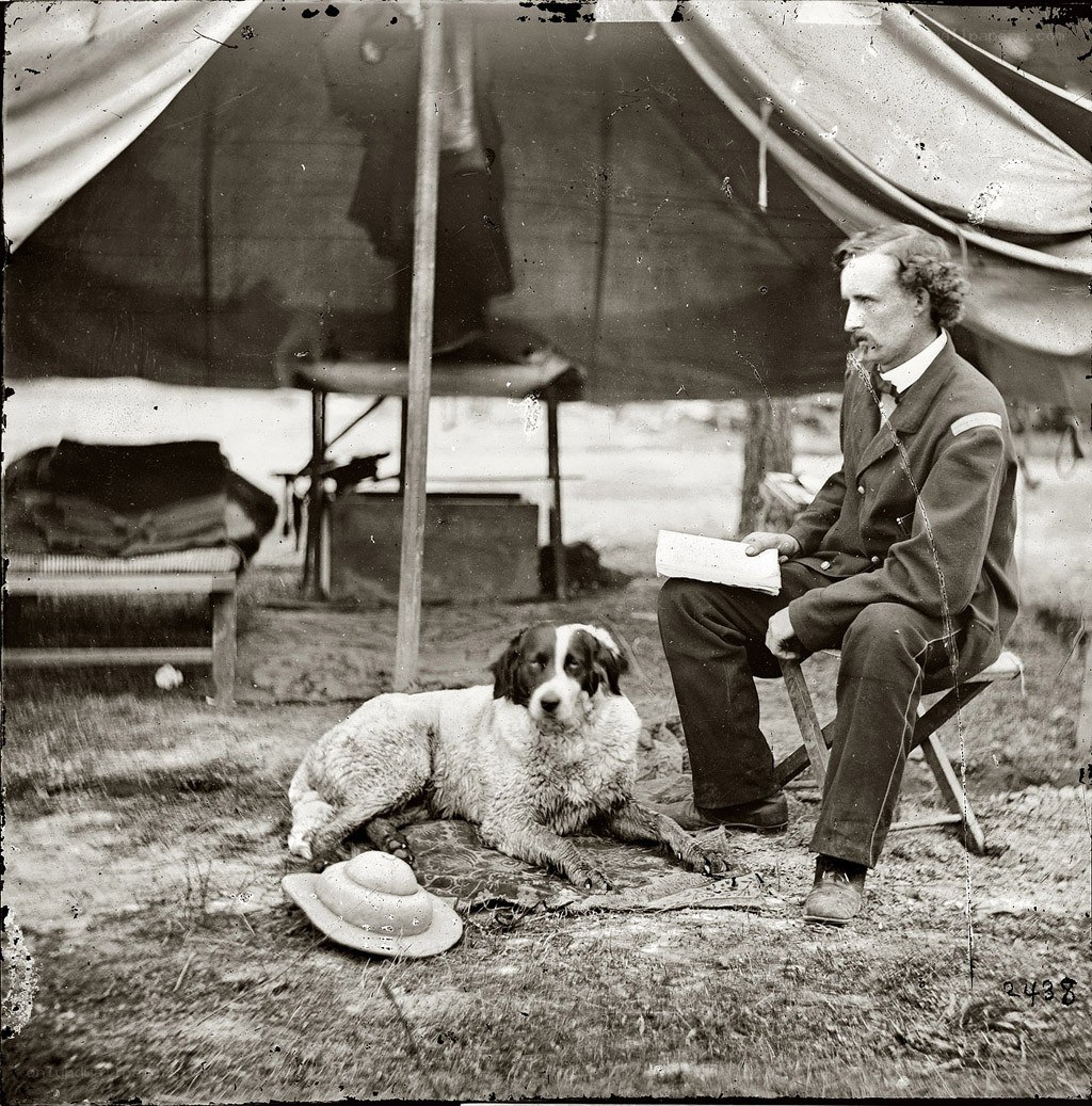 Man with dog in camp