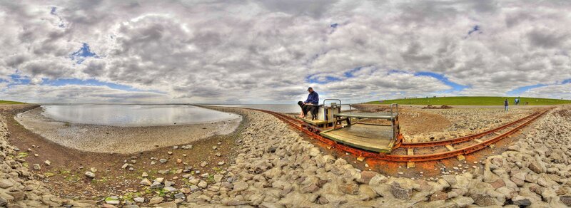 Man with dog on a rail cart