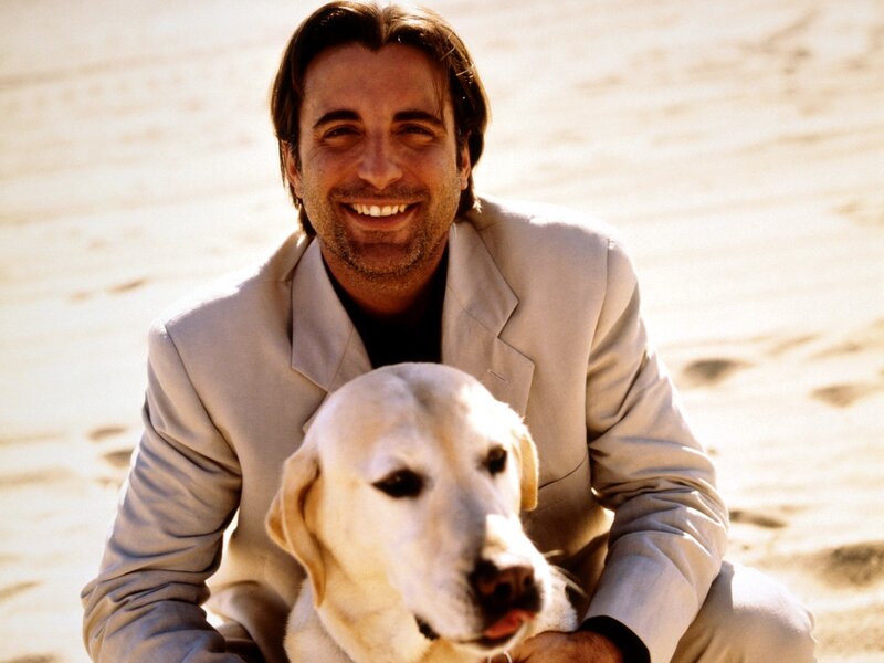man with dog on beach