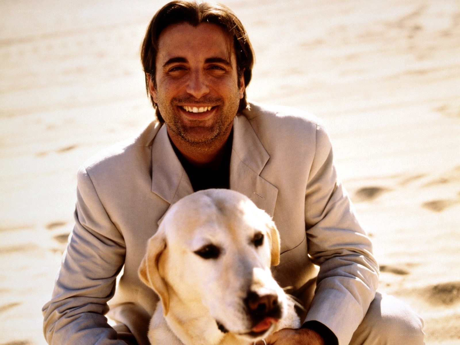 man with dog on beach